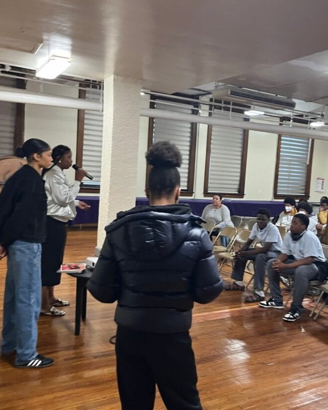 Youth program session — students leading a community gathering